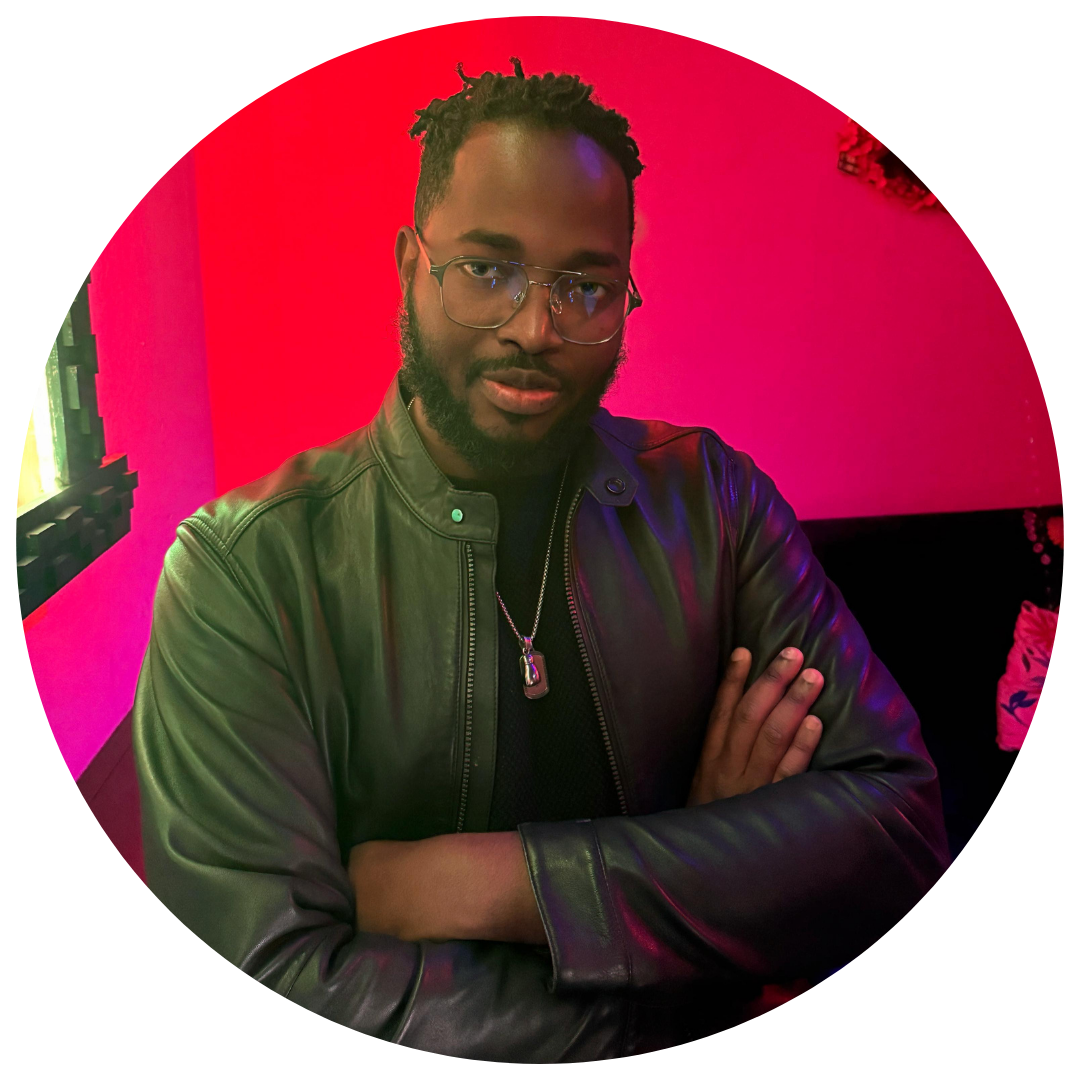 Dr. Tawfiq Abu medical doctor and Ghanian poet sitting with his arms crossed in a leather jacket.